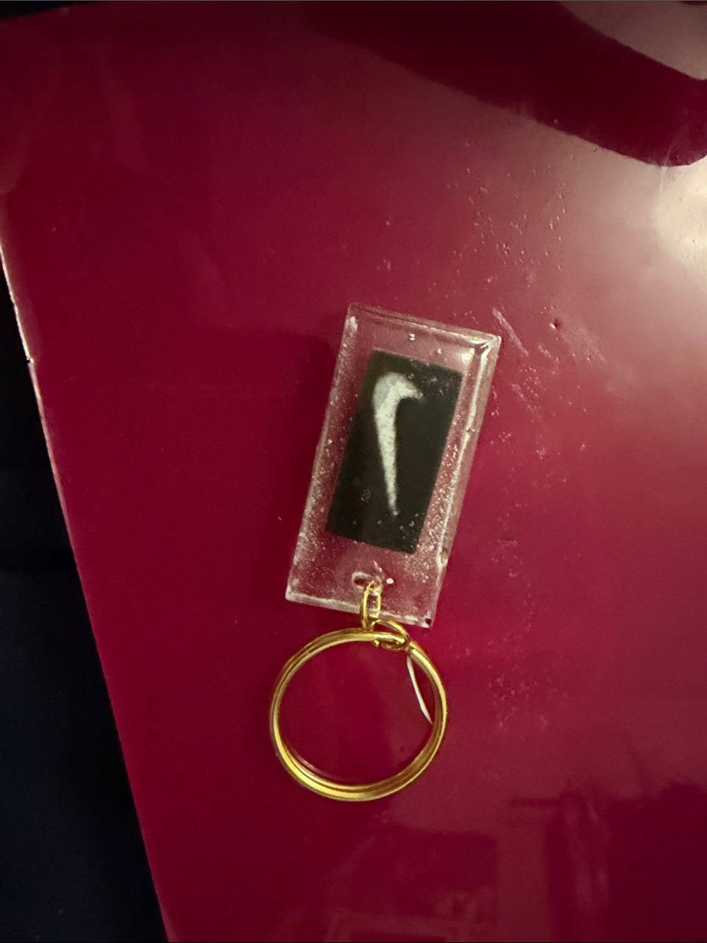 Nike Clear Resin Keychain with Black Swoosh and Gold Ring